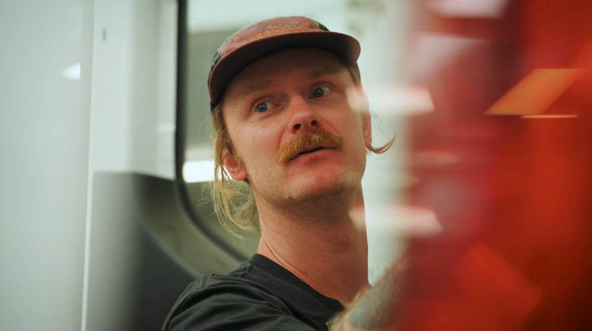 A man in working in a factory environment.