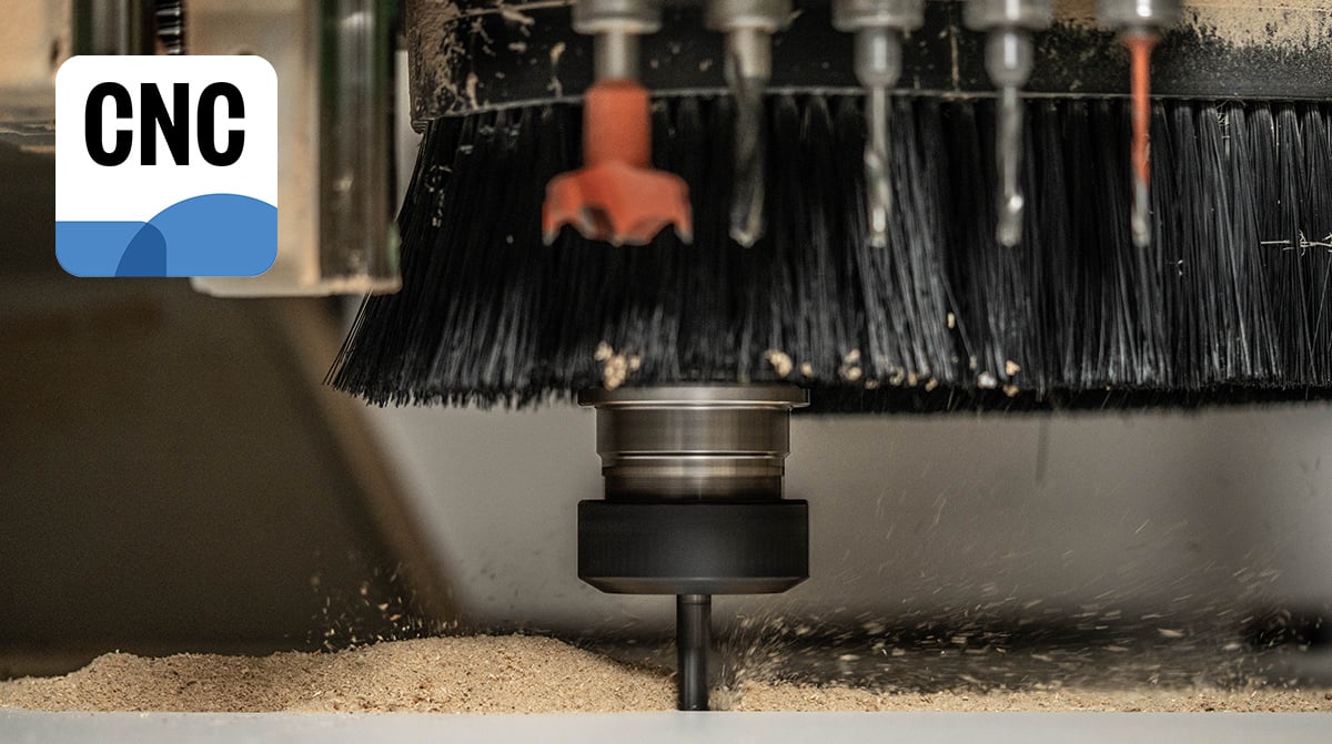A CNC machine cuts wood