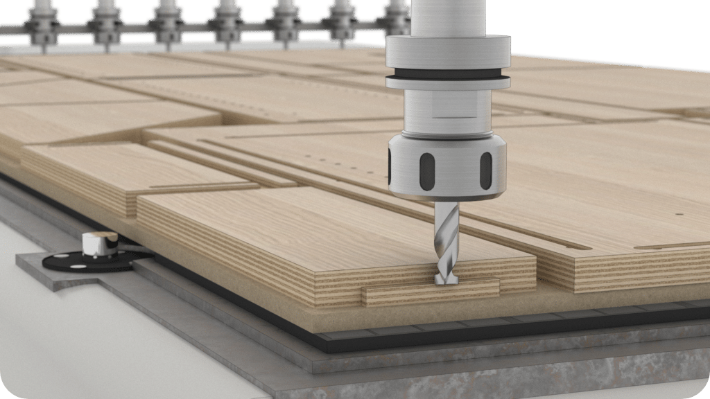 A drill machine is cutting wood